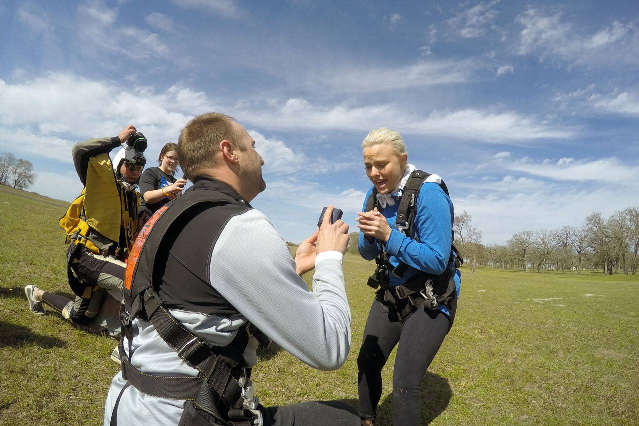 Man gets down to purpose on one knee after the amazing rush of a skydive